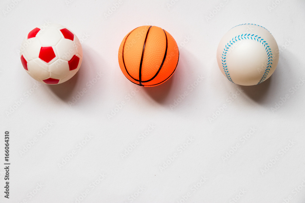 Group of football, baseball and basketball placed on white background Group of football, baseball and basketball placed on white background