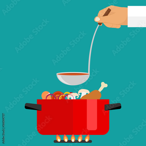 The hand holds a ladle of soup. Casserole with soup on fire