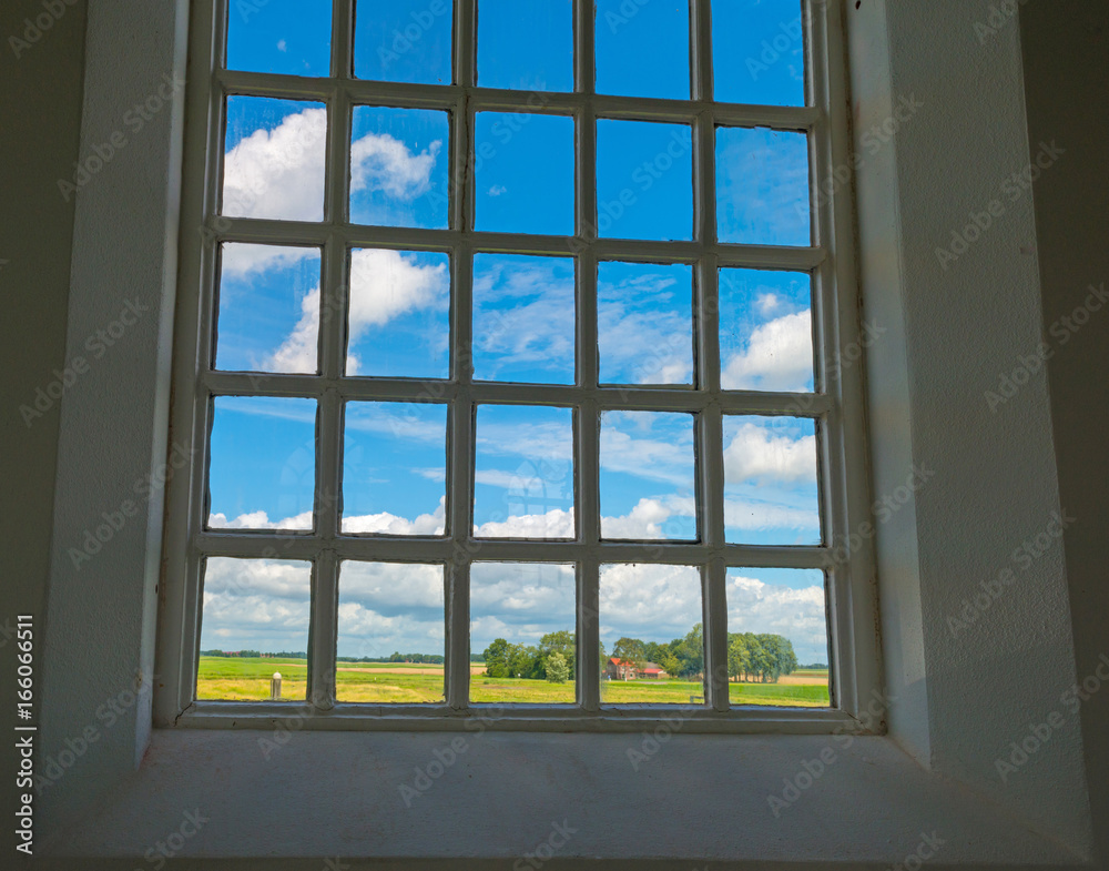 Fototapeta premium Window of an ancient church in sunlight