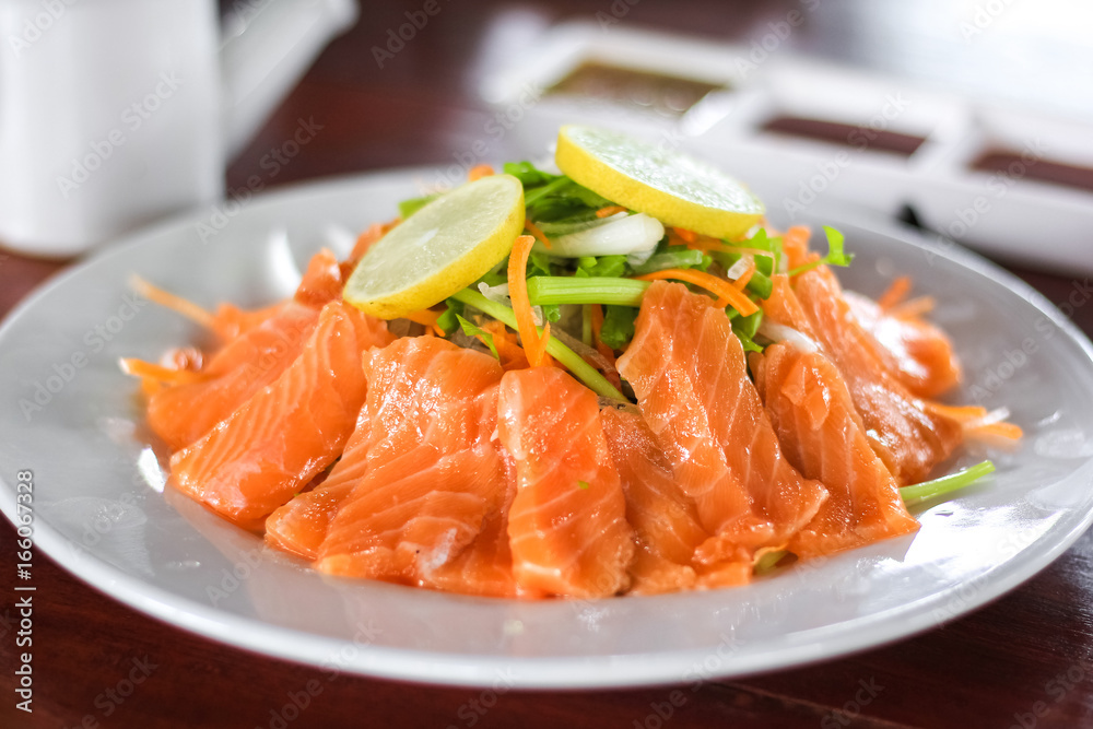 Fresh salmon with vegetable, lemon and sauce Fresh salmon with vegetable, lemon and sauce