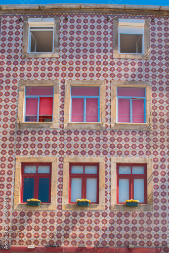 Portugal, colorful red facade, geometric pattern 