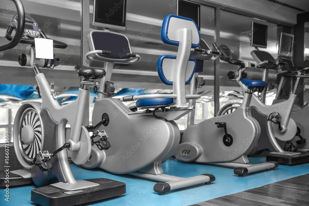 Interior of modern gym with machines Interior of modern gym with machines