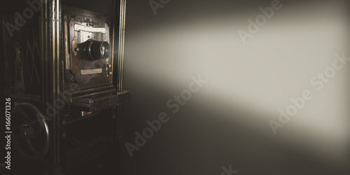 Принти на полотні Vintage movie projector with light on gray backdrop use for background or web banner design