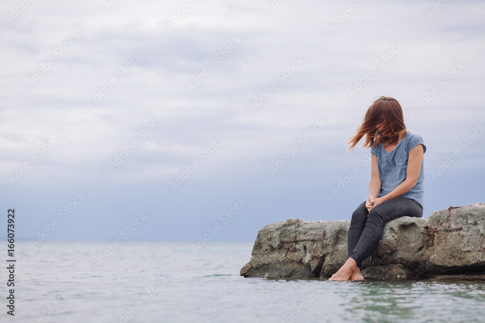 Woman alone and depressed on the bridge