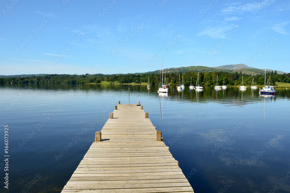 Wooden jetty on Lake Windermere near Ambleside in the Lake District Cumbria England