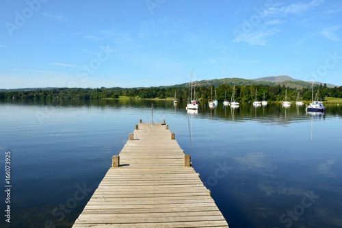 Wooden jetty on Lake Windermere near Ambleside in the Lake District Cumbria England