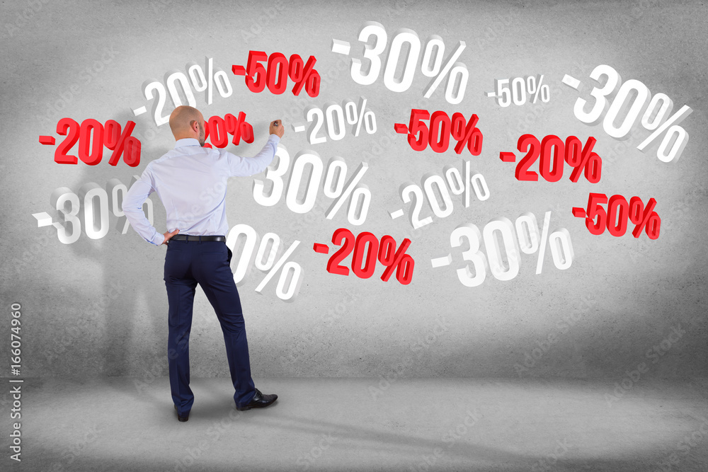 Businessman in front of a wall with sales promotion 20% 30% and 50% flying on an interface - Shopping concept Businessman in front of a wall with sales promotion 20% 30% and 50% flying on an interface - Shopping concept