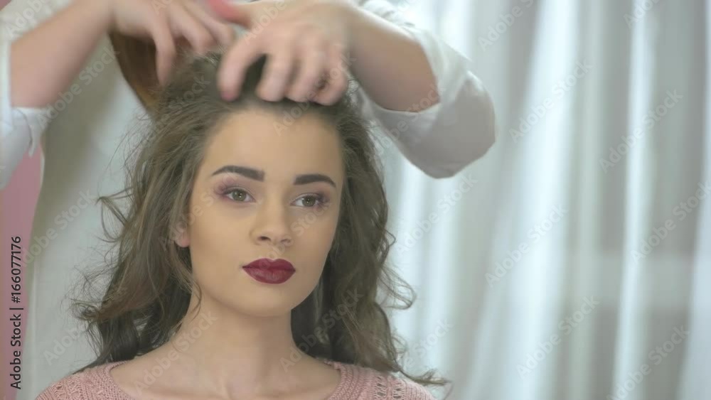 Beautiful woman, hands of hairdresser. Attractive girl in hair salon. Beautiful woman, hands of hairdresser. Attractive girl in hair salon.