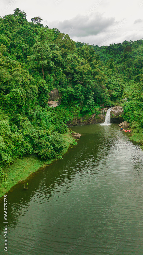 Waterfall in the middle of the forest. Bird eye view , drone. Waterfall in the middle of the forest. Bird eye view , drone.