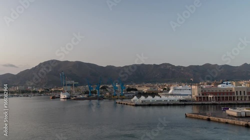 entering the palermo industrial port and shipping harbour shot from a ferry in the early morning, sicily, italy photo