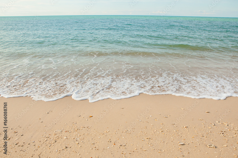 Wave of the sea on the sand beach