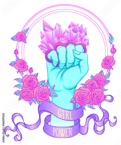 Fight like a girl. Woman's hand with crystal quartz brass knuckles. Fist raised up. Girl Power. Feminism concept.