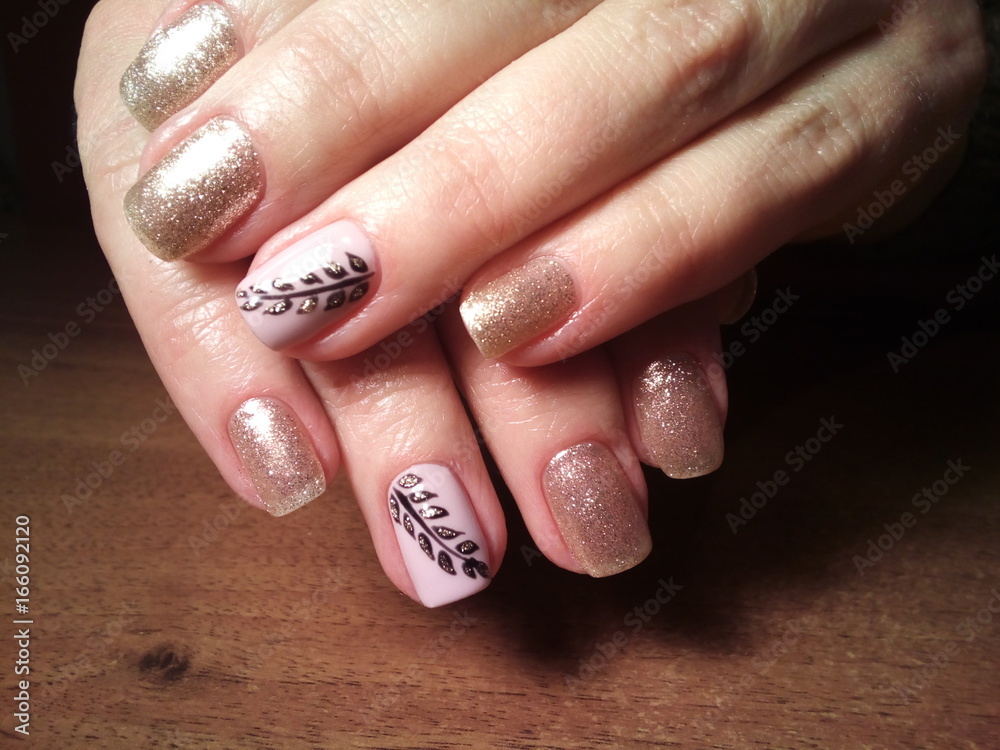 The manicurist excellently made her work a beautiful manicure with a polish gel on her hands and the client is happy The manicurist excellently made her work a beautiful manicure with a polish gel on her hands and the client is happy