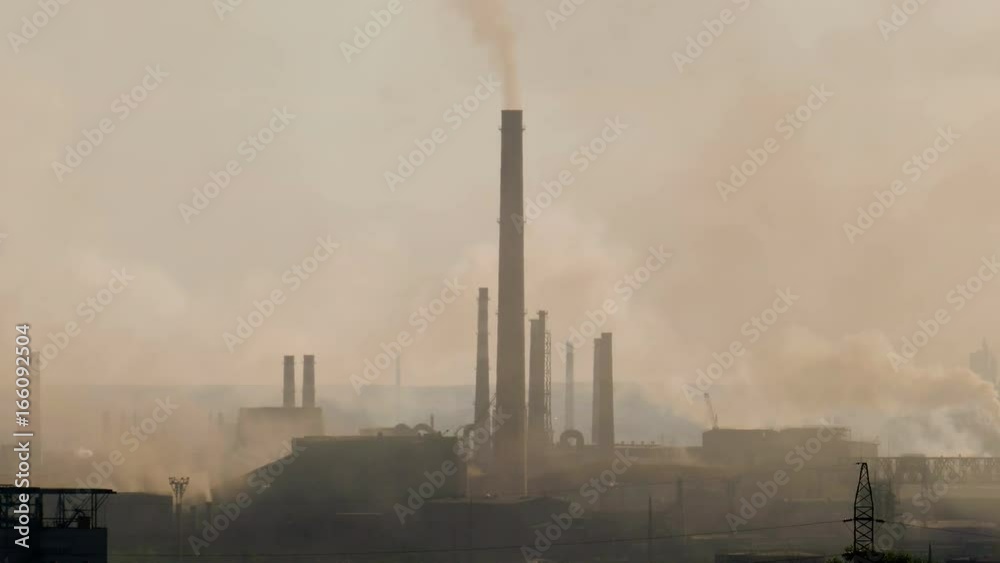 Steel factory industry smoke at sunset Steel factory industry smoke at sunset