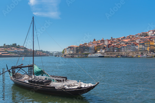 Porto in portugal, traditional boat for porto wine, panorama of the Douro and city 