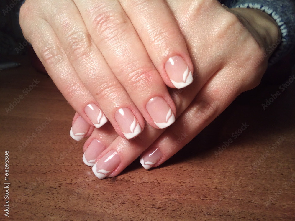 The manicurist excellently made her work a beautiful manicure with a polish gel on her hands and the client is happy The manicurist excellently made her work a beautiful manicure with a polish gel on her hands and the client is happy