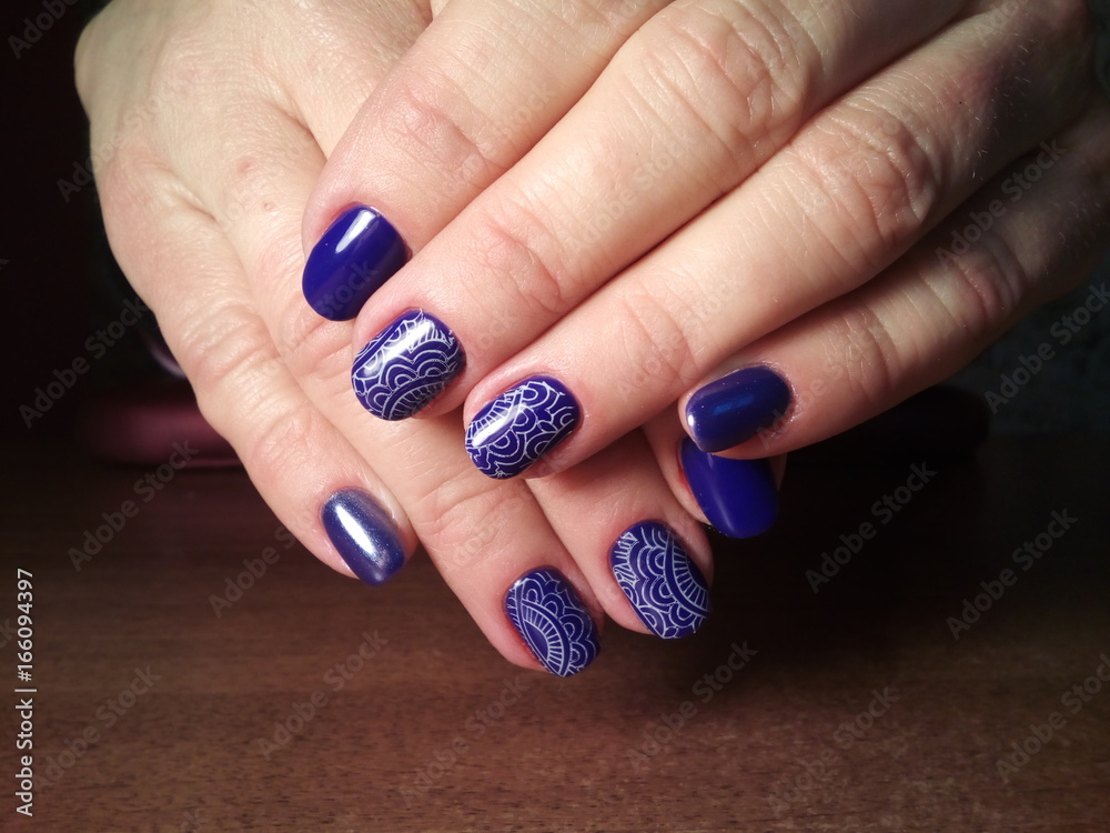 The manicurist excellently made her work a beautiful manicure with a polish gel on her hands and the client is happy The manicurist excellently made her work a beautiful manicure with a polish gel on her hands and the client is happy