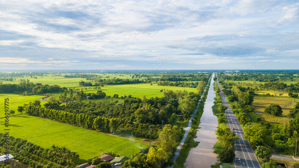 Aerial view of Fields with various types of agriculture and Irrigation canal in rural Thailand