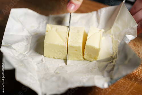 slicing butter brick with knife