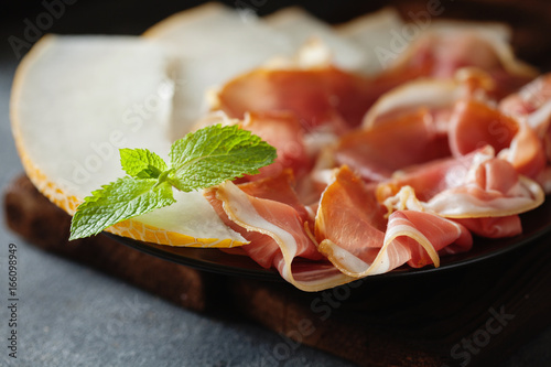 Spanish tapas with slices jamon serrano photo