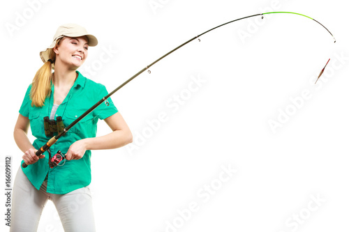 Woman with fishing rod, spinning equipment