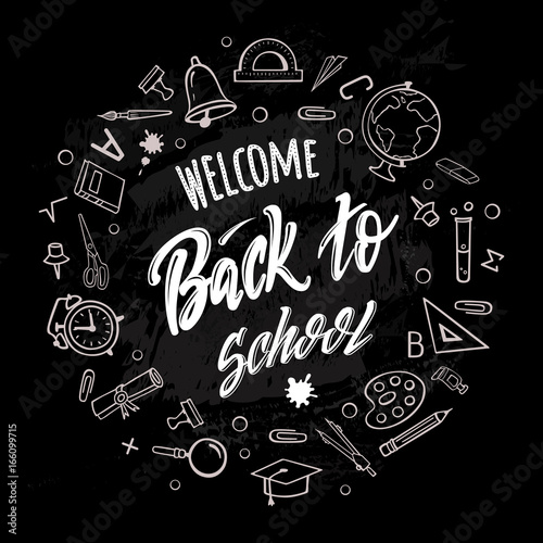 Welcome back to school. Hand-drawn lettering surrounded by school supplies with  on black background. Imitation of chalk drawing on the blackboard. Vector poster.