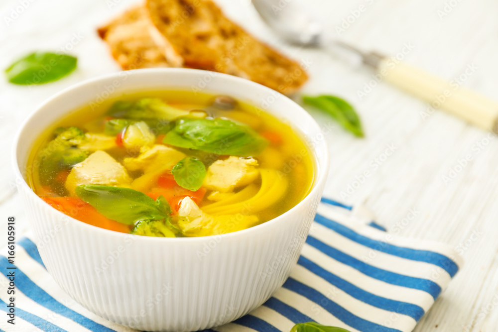 Bowl with delicious turkey soup on napkin Bowl with delicious turkey soup on napkin