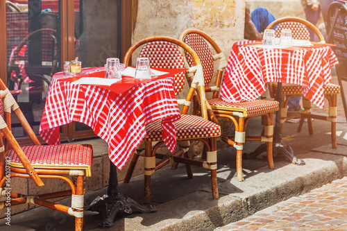 Tables of traditional outdoor French cafe in Paris