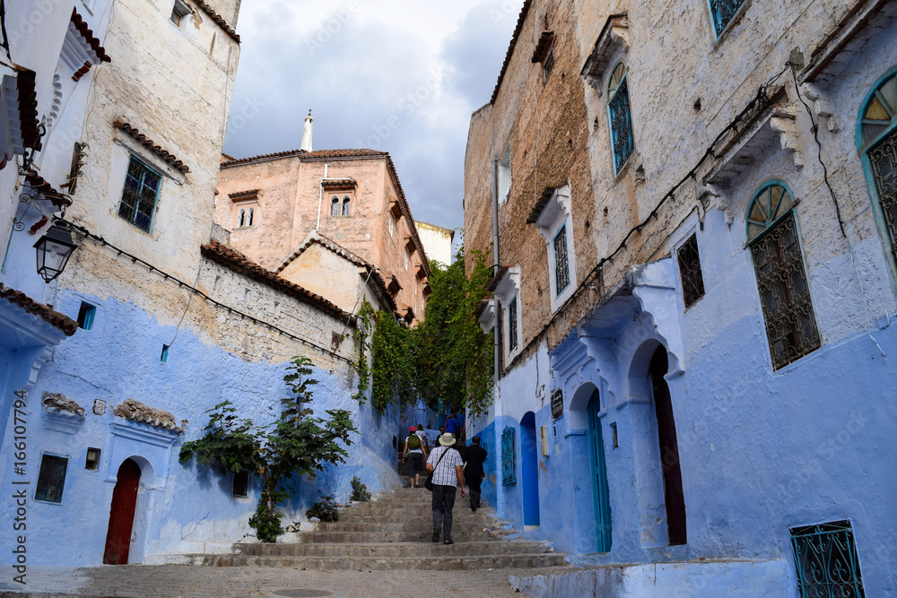 Stairs leading into the blue-painted streets of the Chefchaouen Medina, Morocco