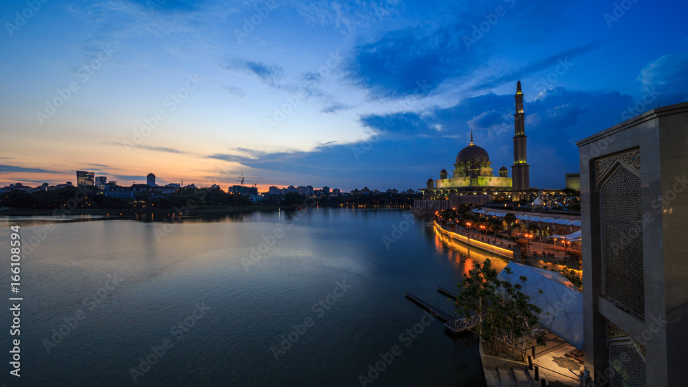 scenery of sunset with beautiful and stunning sun ray in the cloud at Putra Mosque, Putrajaya