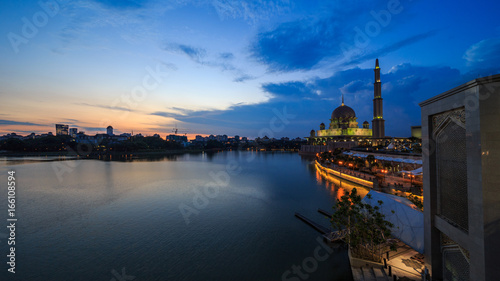 scenery of sunset with beautiful and stunning sun ray in the cloud at Putra Mosque  Putrajaya
