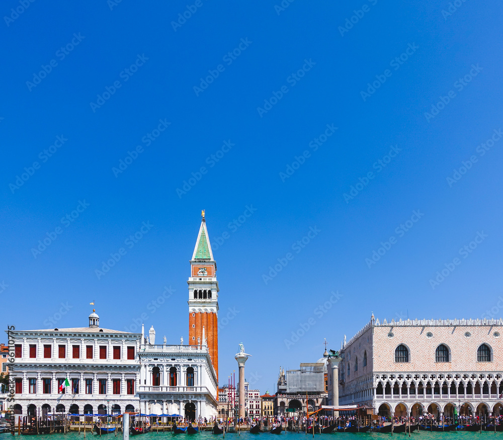 View of Piazza San Marco or St Mark's square, Campanile and Doge's Palace with gondola on grand canal in Venice, Italy
