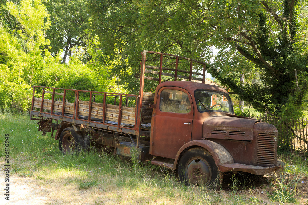 May-23-2017  Picture of an old rusty  truck taken in the forest in Provence, south of France.