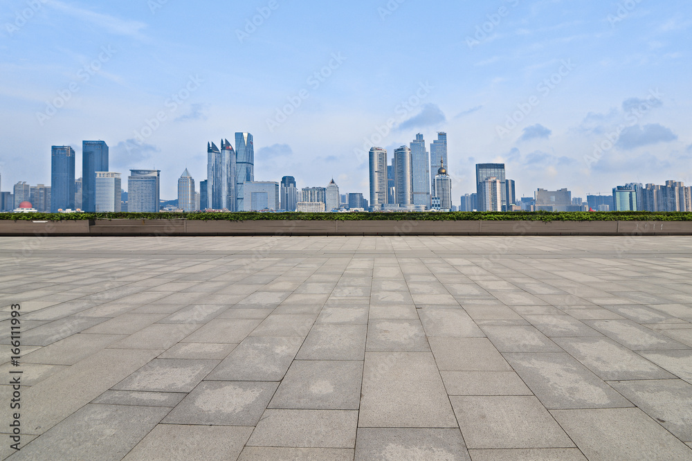 Empty floor with modern skyline and buildings