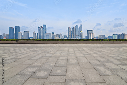 Empty floor with modern skyline and buildings © onlyyouqj