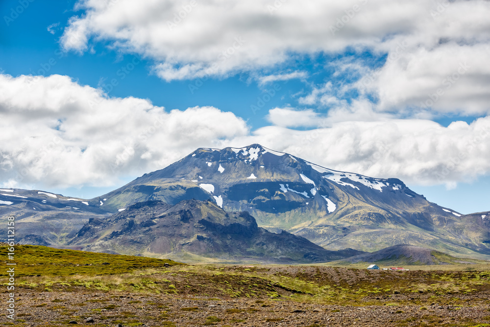 Islandic mountains under cloudy sky Islandic mountains under cloudy sky