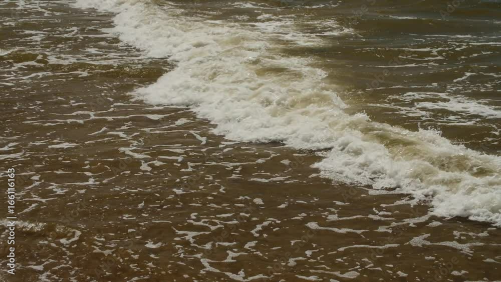 The waves of the sea break into the moss blocks of rock. The waves of the sea break into the moss blocks of rock.