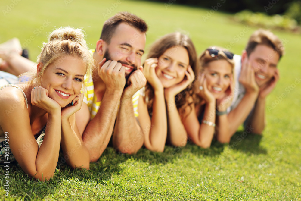 Friends group having fun together on grass Friends group having fun together on grass
