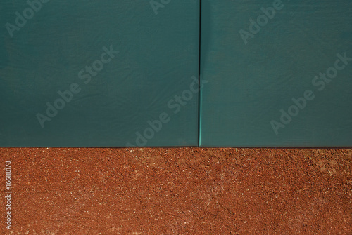 Photography Green home run wall with track dirt.