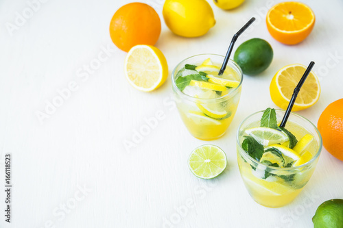 Citrus lemonade with lime, mint and lemon in glasses