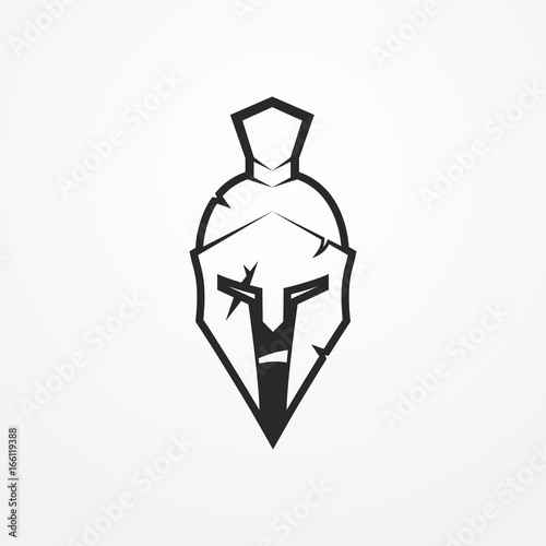 Furious face of a roman warrior in battle helmet. Head of a spartan soldier in flat silhouette style. Sport logotype or design element. Warrior vector stock image.