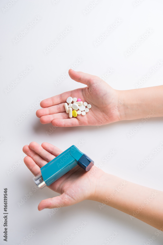 .Inhaler for relief of allergy and asthma attacks in the hand close up .Inhaler for relief of allergy and asthma attacks in the hand close up