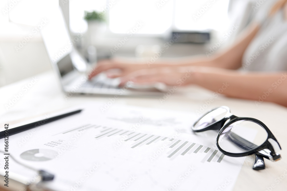 Accountant's work table that fills in the report for director Accountant's work table that fills in the report for director