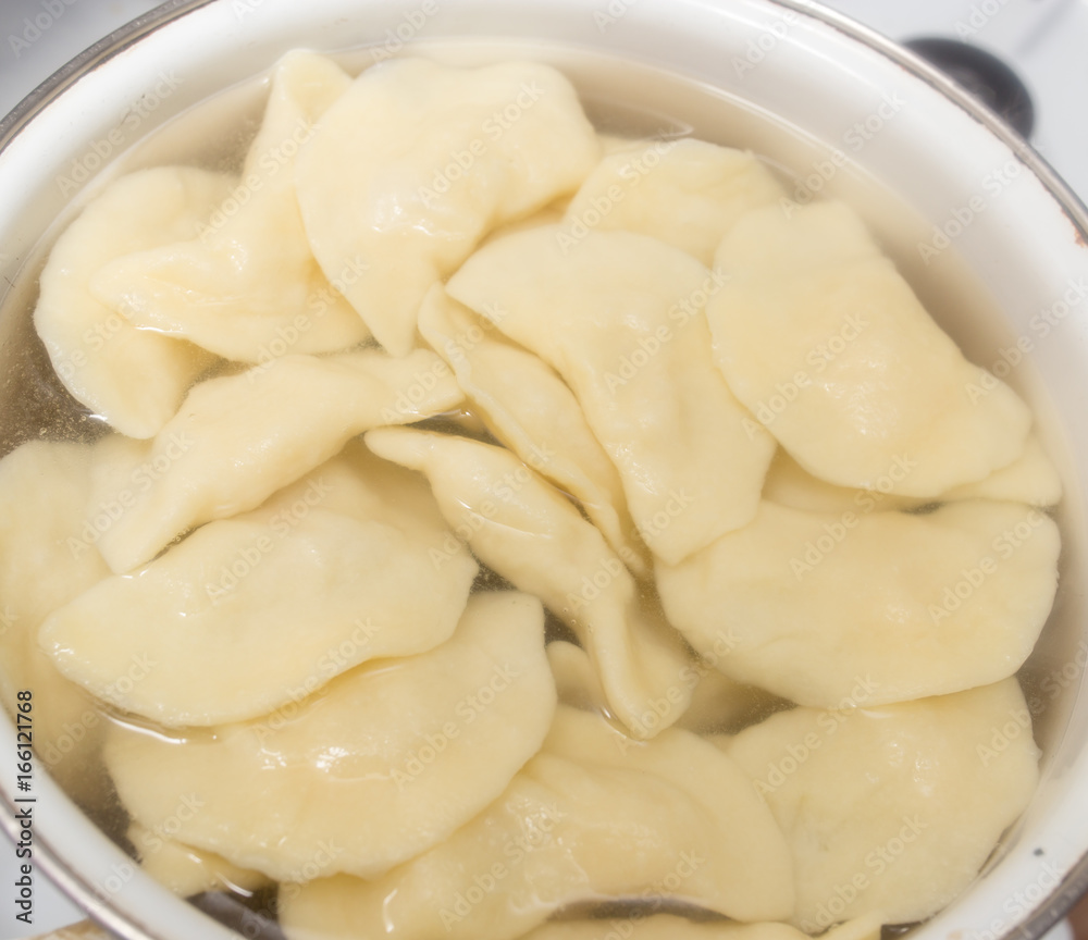 Vareniki with potatoes are cooked in a saucepan