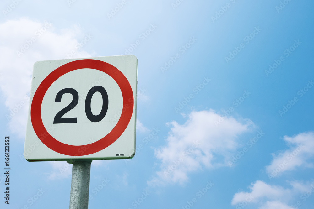 sign warned speed limit not over 20 Km/hr on blue sky background with clipping path