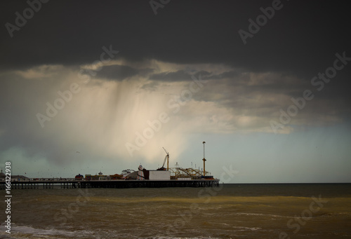 Shot of the Brighton Pier in England, UK against a dramatic sky
