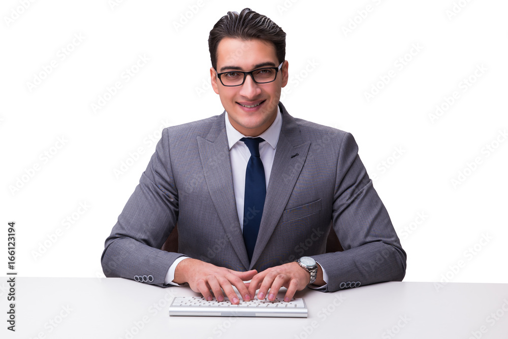 Young businessman typing on a keyboard isolated on white backgro Young businessman typing on a keyboard isolated on white backgro