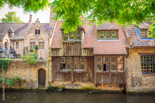 Beautiful canal and traditional houses in the old town of Bruges (Brugge), Belgium