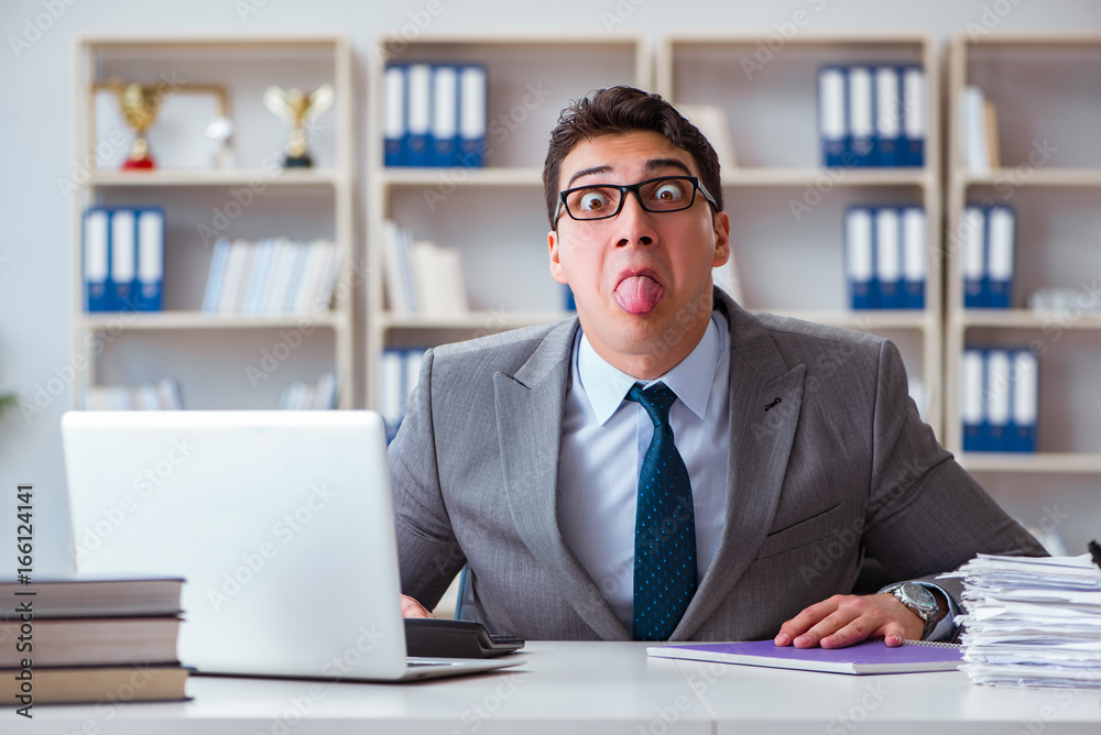 Funny businessman clown acting silly in the office Funny businessman clown acting silly in the office