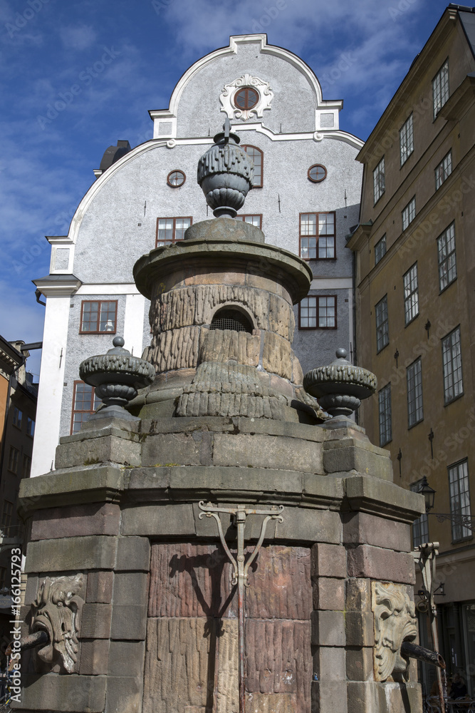 Obraz premium Building Facade and Fountain Stortorget Square; Gamla Stan - City Centre; Stockholm